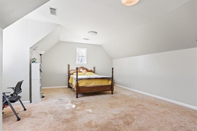 bedroom with lofted ceiling, baseboards, light carpet, and visible vents