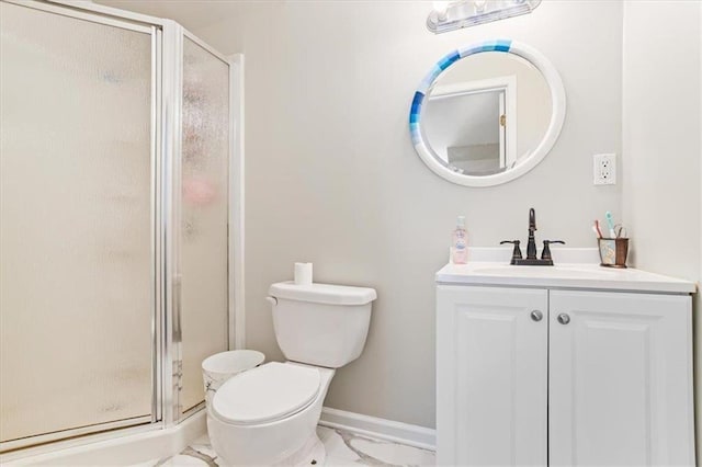 full bath featuring toilet, vanity, baseboards, marble finish floor, and a shower stall