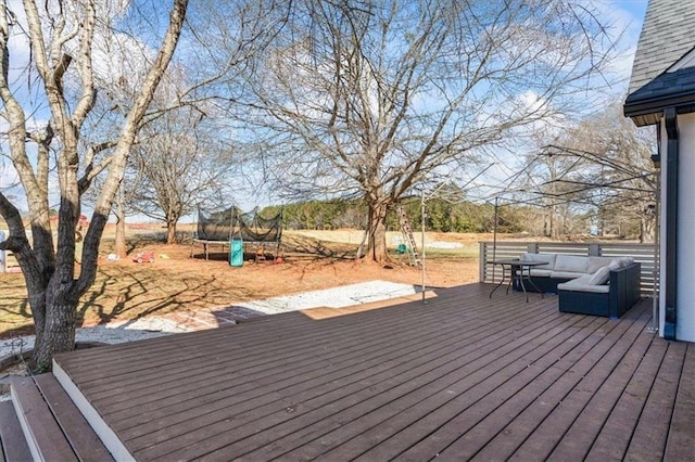 deck featuring a trampoline and outdoor lounge area