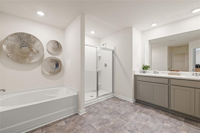 bathroom featuring vanity and plus walk in shower