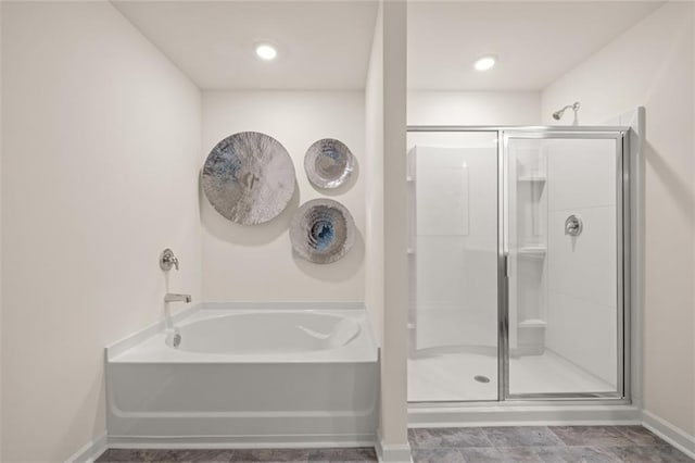 bathroom with shower with separate bathtub