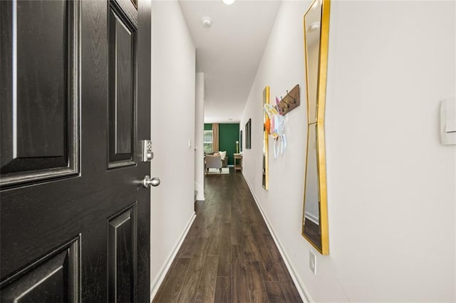 hall with dark hardwood / wood-style floors