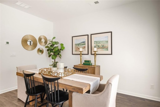 dining space featuring dark hardwood / wood-style flooring