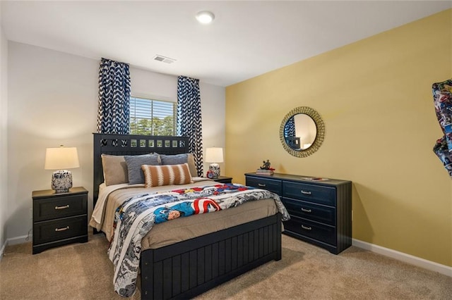 bedroom featuring light carpet