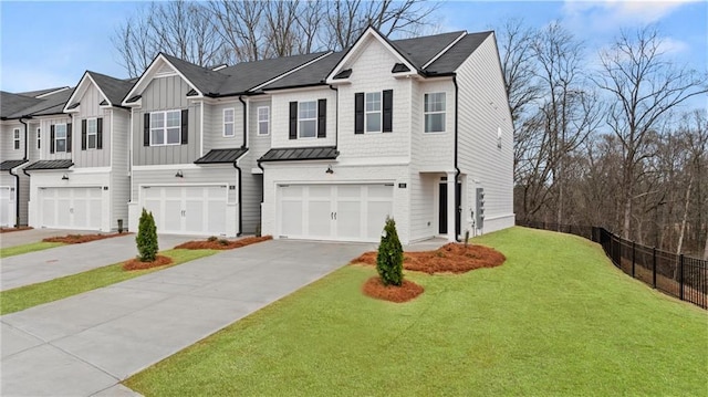 view of front facade with a garage and a front lawn