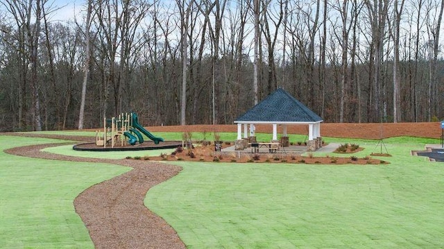 view of playground with a yard and a gazebo