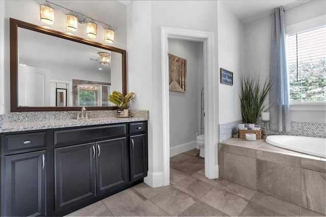 2953 Balvenie Pl, Acworth, GA 30101 - bathroom featuring a garden tub, vanity, plenty of natural light, and toilet