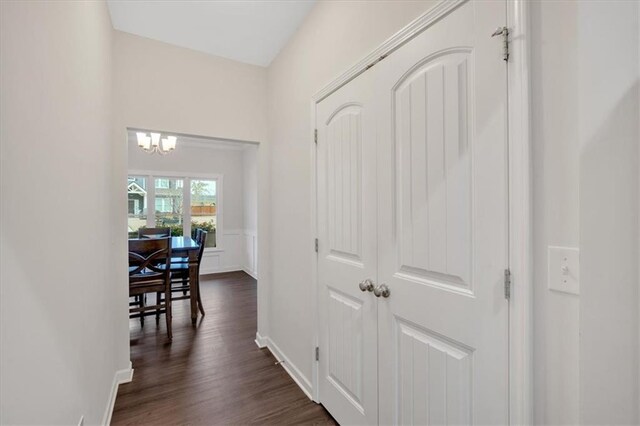 822 Pine Way, Dallas, GA 30157 - hall with baseboards, a notable chandelier, and dark wood finished floors