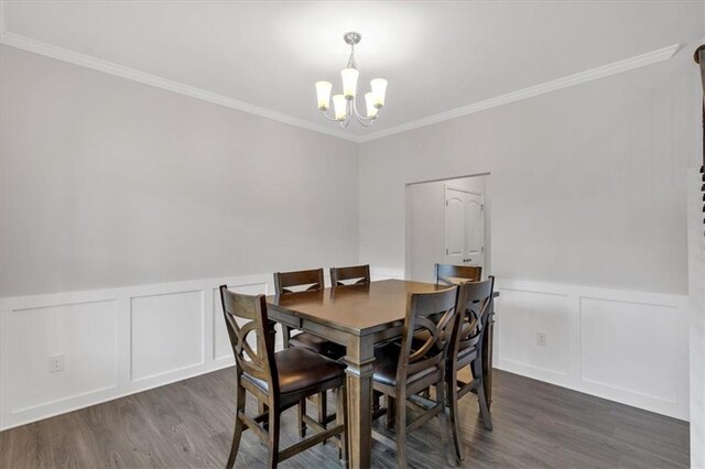 822 Pine Way, Dallas, GA 30157 - dining area with ornamental molding, wood finished floors, and an inviting chandelier