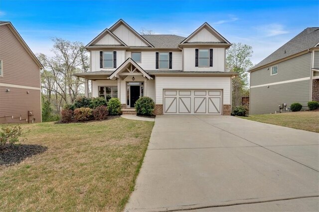 822 Pine Way, Dallas, GA 30157 - craftsman house featuring a front lawn, a garage, board and batten siding, and concrete driveway