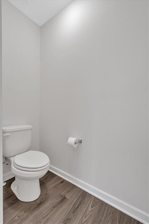 822 Pine Way, Dallas, GA 30157 - bathroom featuring baseboards, wood finished floors, and toilet