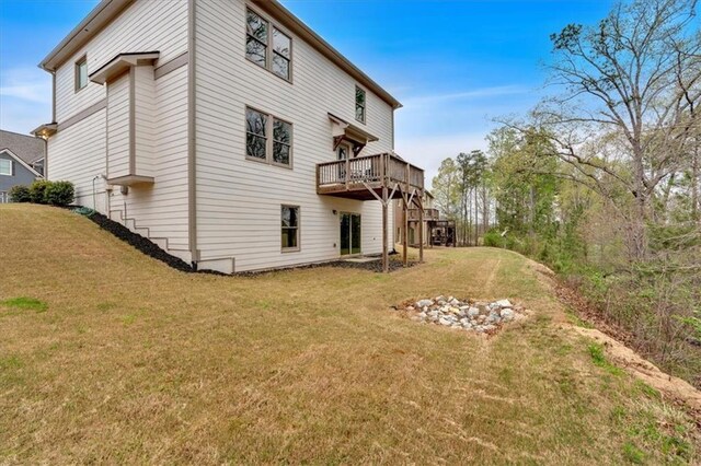 822 Pine Way, Dallas, GA 30157 - rear view of house with a lawn and a deck