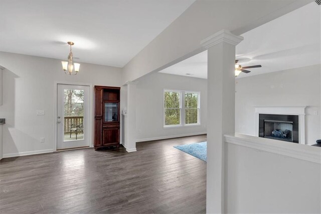 822 Pine Way, Dallas, GA 30157 - foyer entrance featuring ceiling fan with notable chandelier, a fireplace, baseboards, and dark wood-style floors