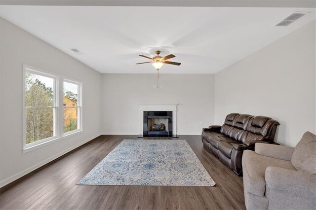 822 Pine Way, Dallas, GA 30157 - living room featuring a fireplace with flush hearth, visible vents, dark wood-type flooring, and a ceiling fan