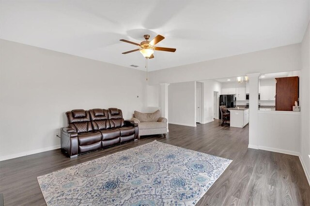 822 Pine Way, Dallas, GA 30157 - living area with a ceiling fan, dark wood-style floors, baseboards, visible vents, and ornate columns