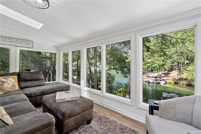 114 Narrows Loop, Waleska, GA 30183 - sunroom with plenty of natural light, vaulted ceiling, a water view, a skylight, and wood finished floors
