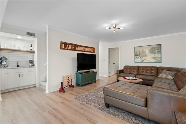 114 Narrows Loop, Waleska, GA 30183 - living room featuring ornamental molding, light wood-type flooring, stairs, bar area, and baseboards