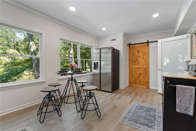 114 Narrows Loop, Waleska, GA 30183 - kitchen featuring stainless steel fridge, healthy amount of natural light, light wood-type flooring, crown molding, and baseboards