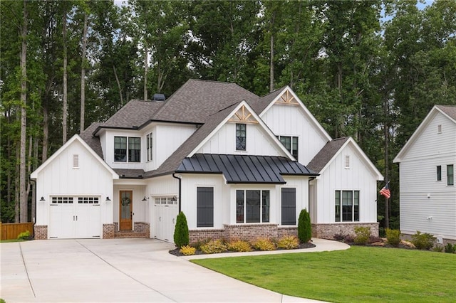 modern farmhouse with a front lawn and a garage