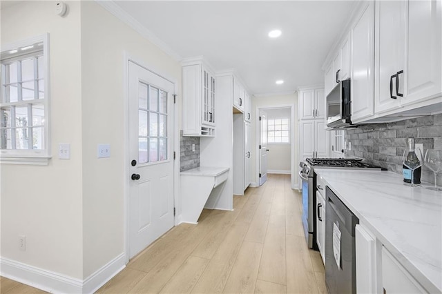 1830 Mayfield Rd, Alpharetta, GA 30009 - kitchen featuring appliances with stainless steel finishes, decorative backsplash, light wood-type flooring, white cabinets, and recessed lighting