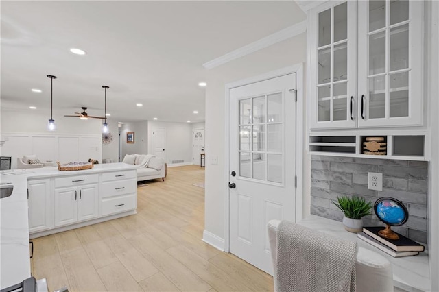 1830 Mayfield Rd, Alpharetta, GA 30009 - kitchen with a ceiling fan, glass insert cabinets, ornamental molding, open floor plan, and white cabinetry