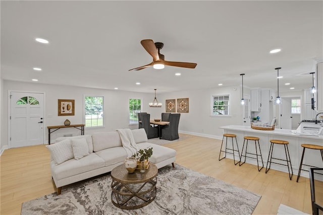 1830 Mayfield Rd, Alpharetta, GA 30009 - living room featuring recessed lighting, light wood-style flooring, healthy amount of natural light, a ceiling fan, and baseboards