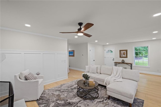 1830 Mayfield Rd, Alpharetta, GA 30009 - living room with recessed lighting, ceiling fan, light wood-style floors, a wainscoted wall, and crown molding
