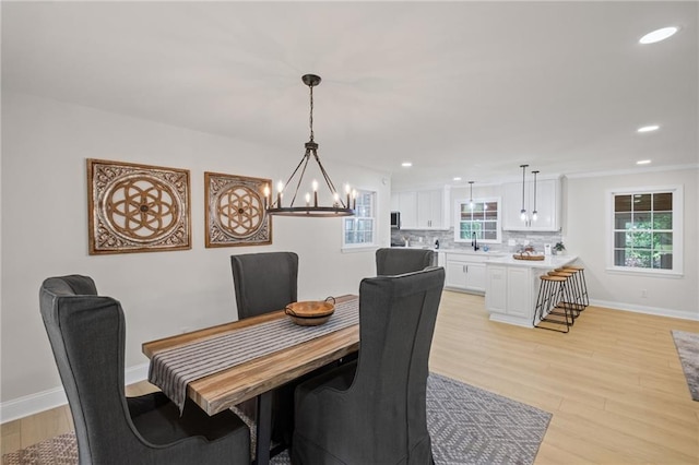 1830 Mayfield Rd, Alpharetta, GA 30009 - dining space featuring light wood-style flooring, a chandelier, baseboards, and recessed lighting