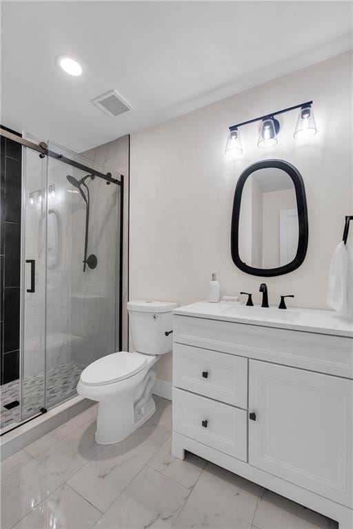 full bath featuring marble look tiles, toilet, vanity, a shower stall, and baseboards