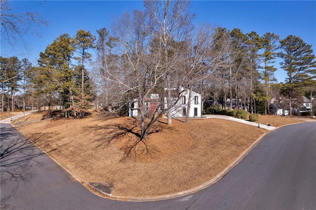 view of front of property with concrete driveway and a garage