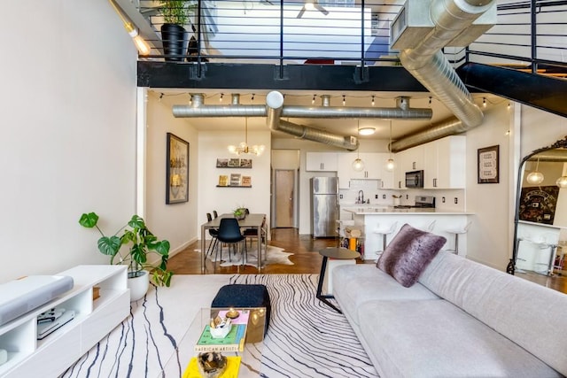 living room featuring a notable chandelier