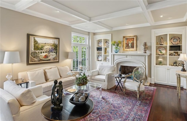 living area with coffered ceiling, a fireplace, dark wood-style floors, and beam ceiling