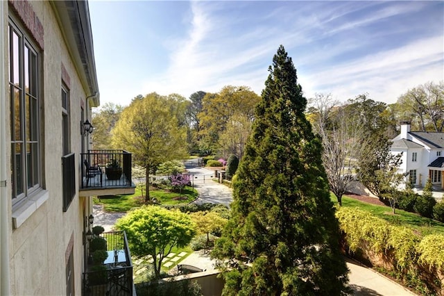 view of yard with a balcony
