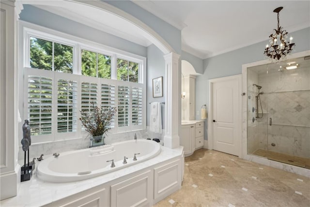 bathroom with a garden tub, a shower stall, ornate columns, vanity, and ornamental molding