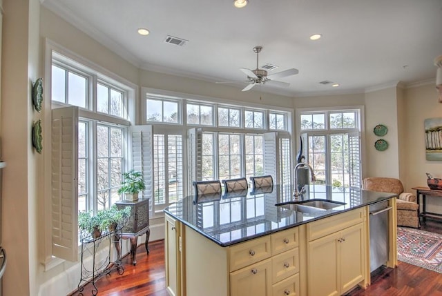 kitchen with a sink, visible vents, open floor plan, ornamental molding, and dark wood-style floors