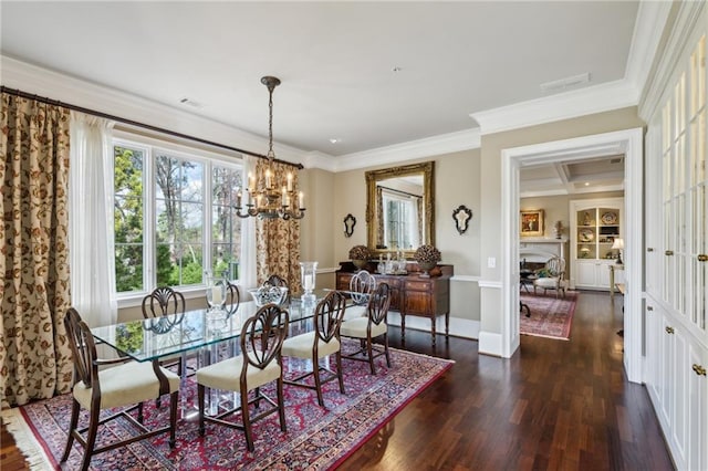 dining area with dark wood finished floors, ornamental molding, visible vents, a chandelier, and baseboards