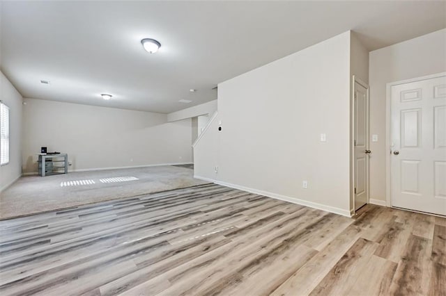 spare room with light hardwood / wood-style flooring