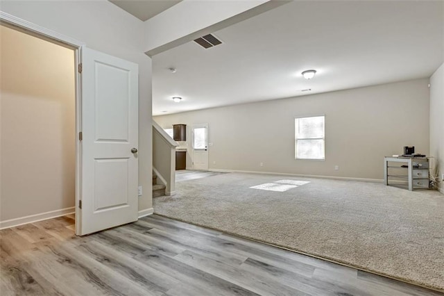 unfurnished room with light hardwood / wood-style floors