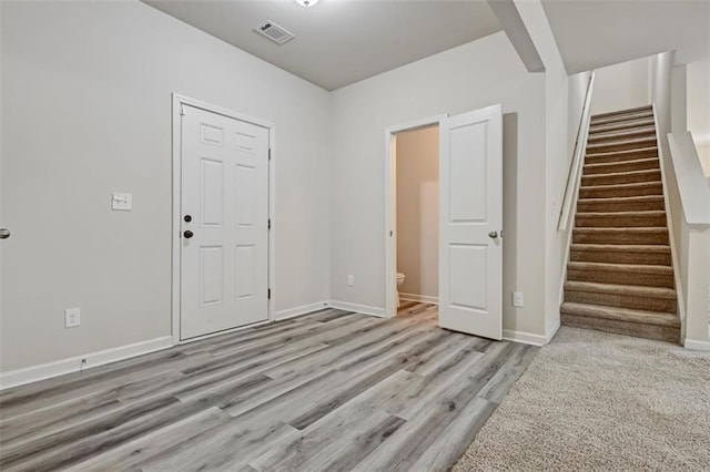 foyer entrance with light hardwood / wood-style flooring