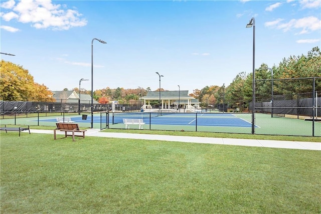 view of sport court featuring a yard