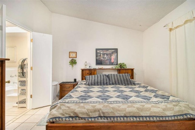 tiled bedroom featuring lofted ceiling