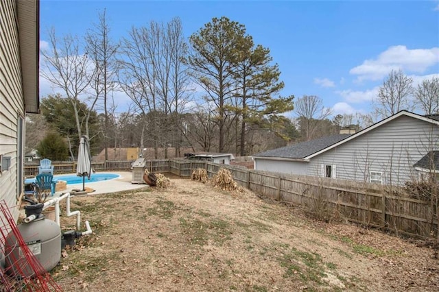 view of yard with a covered pool