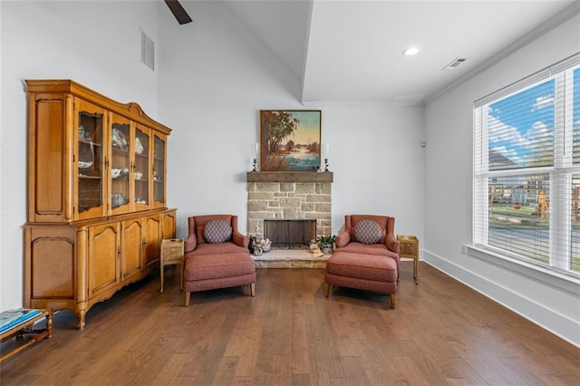 352 Davis St, Monroe, GA 30655 - living area featuring a fireplace, baseboards, dark wood finished floors, and visible vents