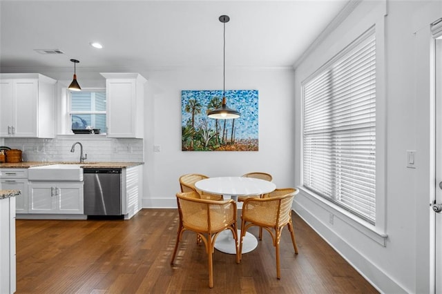 352 Davis St, Monroe, GA 30655 - dining room with crown molding, visible vents, baseboards, and dark wood finished floors