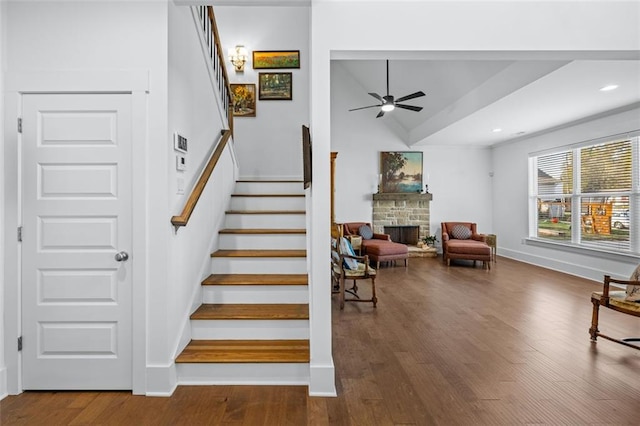 352 Davis St, Monroe, GA 30655 - stairs featuring a ceiling fan, a stone fireplace, recessed lighting, wood finished floors, and baseboards