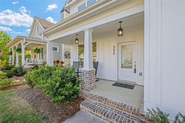 352 Davis St, Monroe, GA 30655 - doorway to property featuring board and batten siding and a porch