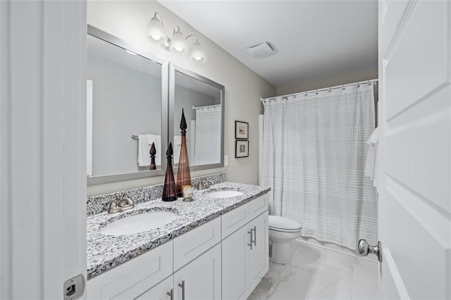 352 Davis St, Monroe, GA 30655 - full bathroom featuring double vanity, marble finish floor, a sink, and toilet