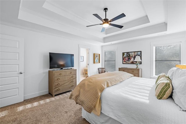 352 Davis St, Monroe, GA 30655 - carpeted bedroom featuring crown molding, a tray ceiling, baseboards, and ceiling fan