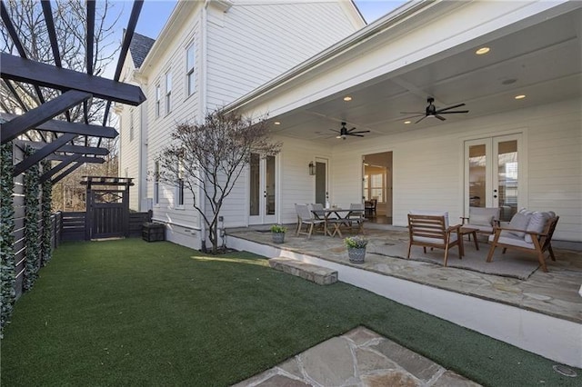 exterior space featuring an outdoor hangout area, french doors, and ceiling fan