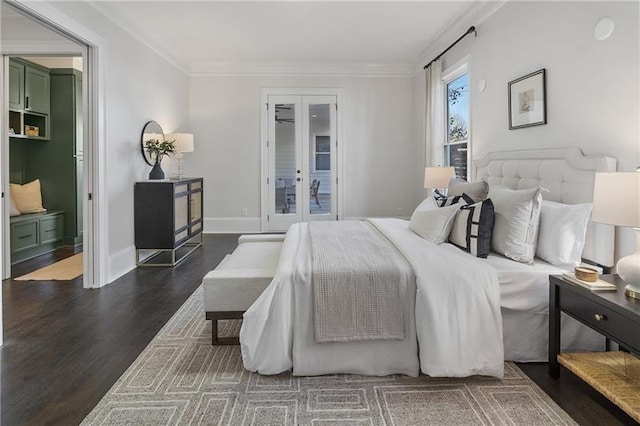 bedroom featuring ornamental molding, dark wood-type flooring, and french doors